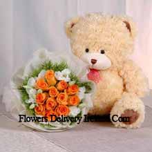Bunch Of 11 Orange Roses And A Medium Sized Cute Teddy Bear Delivered in Ireland