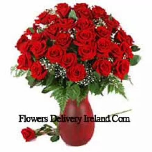 40 Red Roses And Seasonal Fillers In A Glass Vase