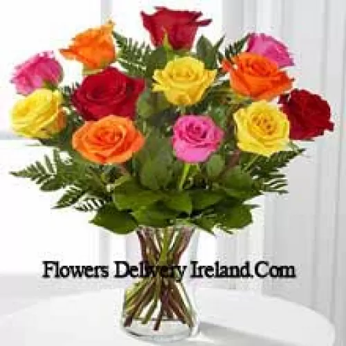 11 Mixed Colored Roses With Some Ferns in A Vase