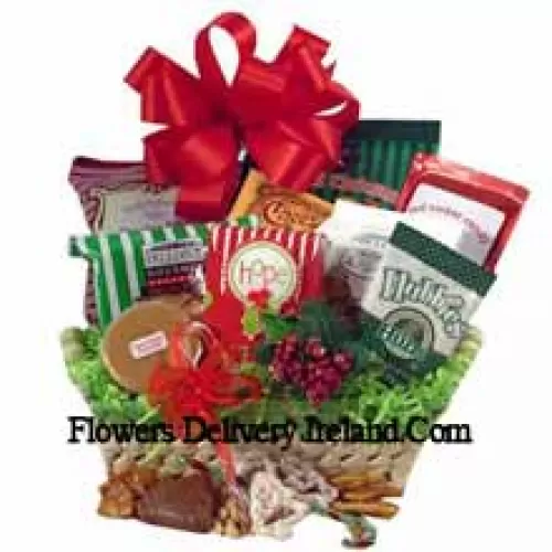 Celebrate holiday traditions with a gift that boasts good taste! The festive natural basket is packed full of delicious time-honored treats. We've included peanuts, fudge, pretzels, cheddar biscuits, cookies, snack mix, peanut brittle, sprinkled pretzels, Christmas popcorn and chocolate filled peppermints. We've also included a keepsake tree ornament to top off this heartfelt holiday gift. (Please Note That We Reserve The Right To Substitute Any Product With A Suitable Product Of Equal Value In Case Of Non-Availability Of A Certain Product)